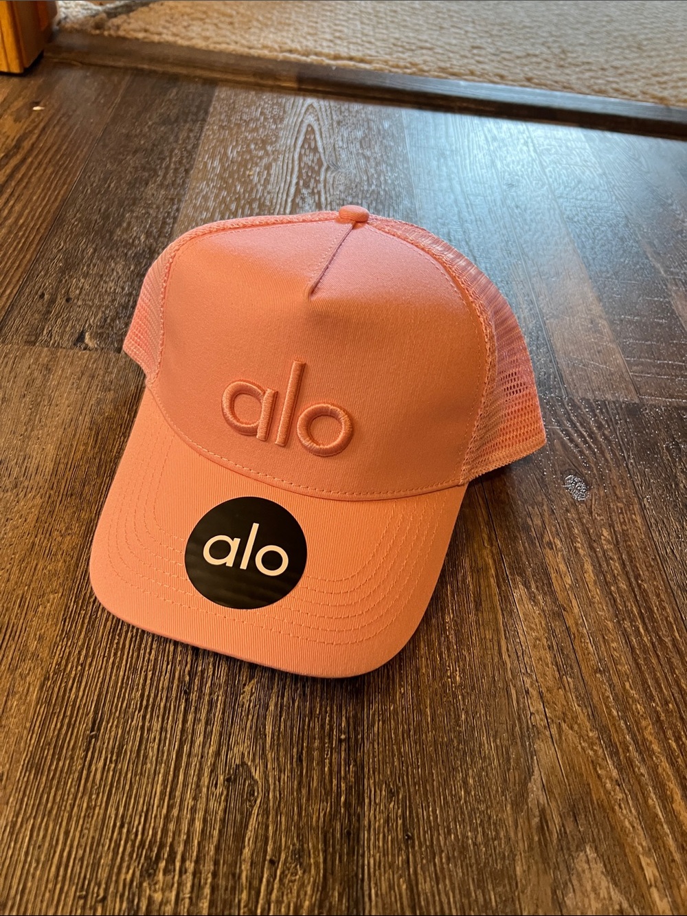 Alo Logo Trucker Hat in Coral Pink